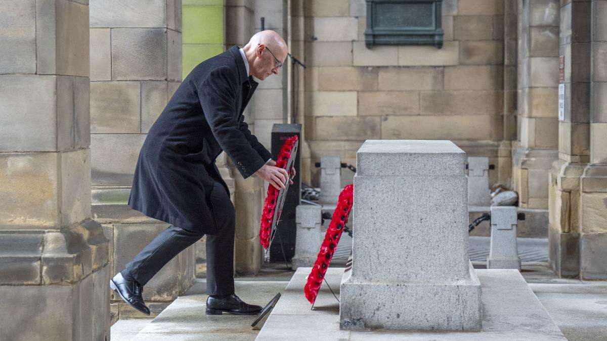 Swinney pays tribute to war hero uncle as nation pauses on Remembrance Sunday