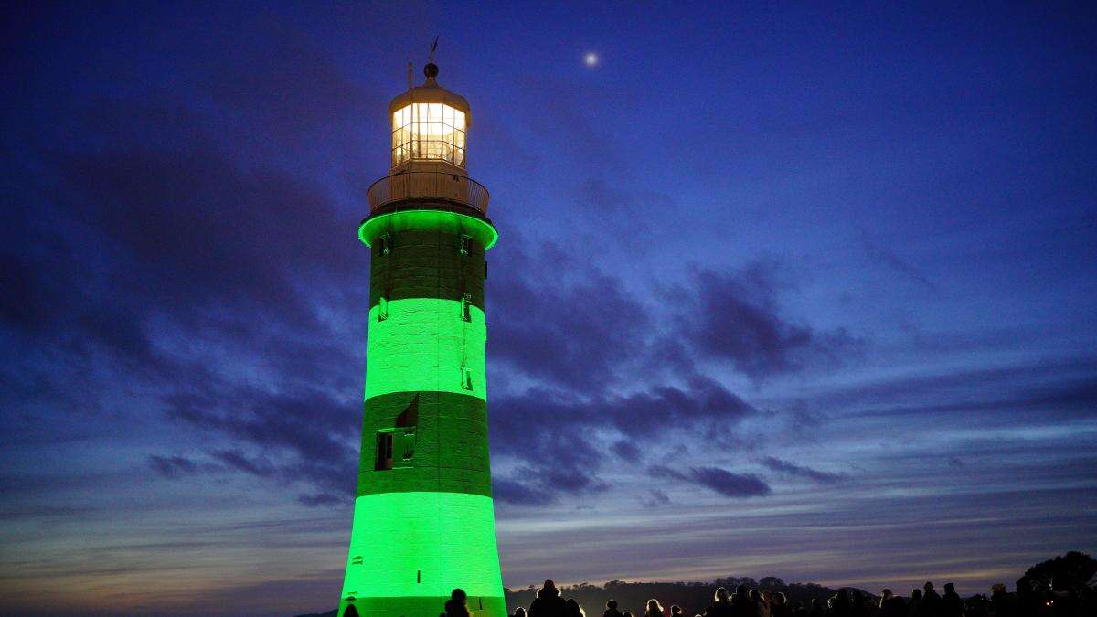 Plymouth lighthouse lit up green in memory of university lecturer