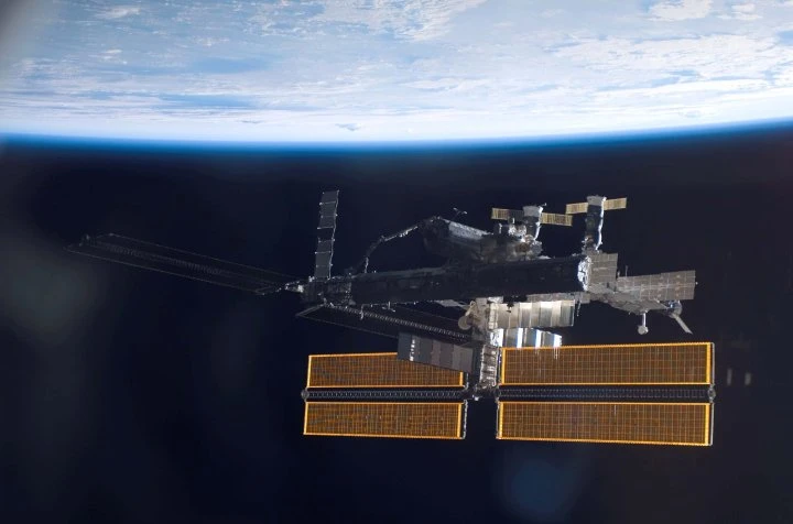 Astronauts continue work to install solar panels outside International Space Station