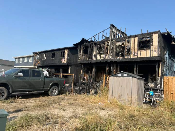 Dog dead, 12 people displaced after fire destroys 2 townhomes in southeast Calgary