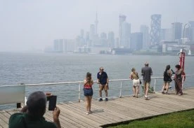 Canadians face air quality, heat warnings as some stuck indoors from both