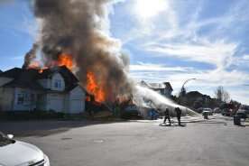 Woman still unaccounted for after home explosion, fire in Langley, B.C.