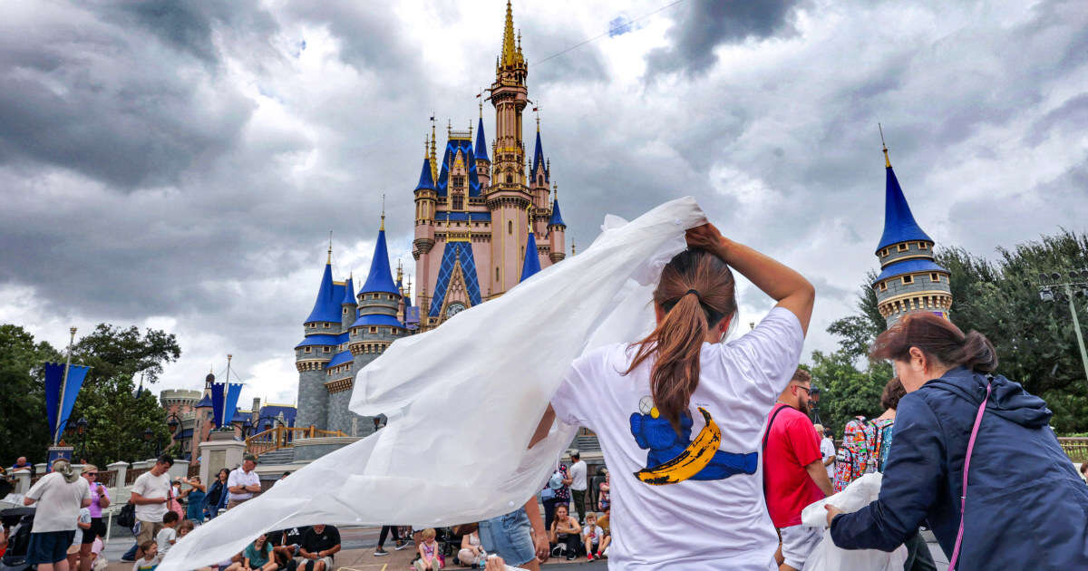 Tourists who came for a sunny Disney vacation are instead stranded by the storm