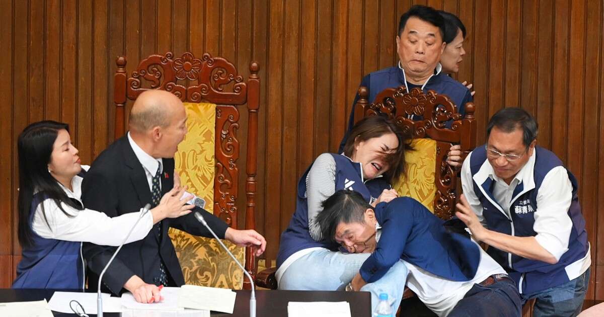 Taiwan lawmakers exchange blows in bitter dispute over parliament reforms