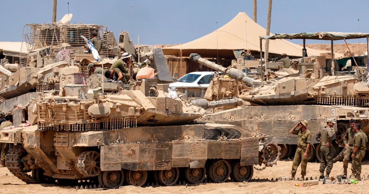 Satellite images show Israel building up forces for a possible ground invasion of Gaza, sources say