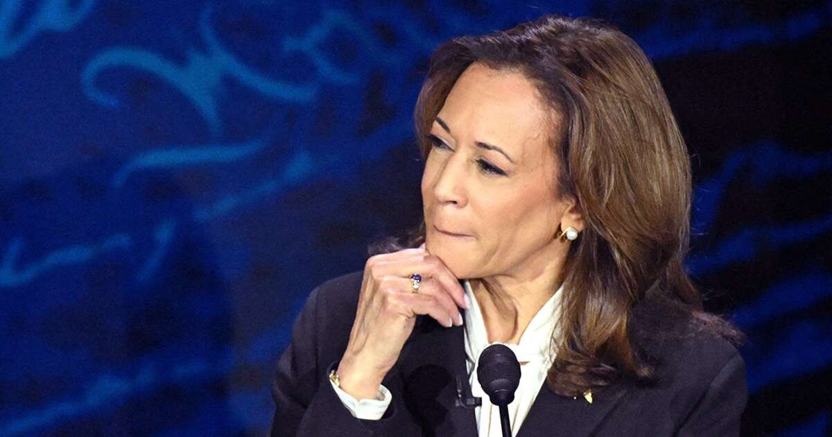 Trump glares angrily ahead as Harris stares him down during tense debate