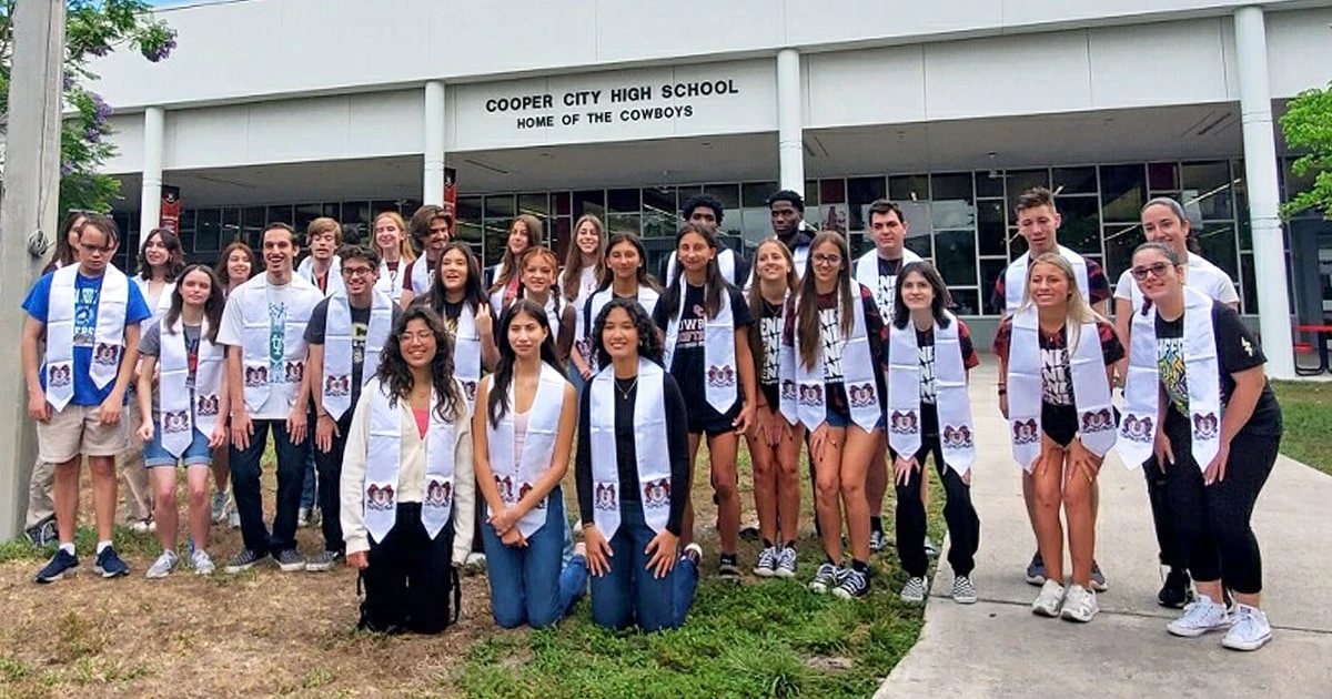 14 sets of twins and one set of triplets graduate from the same high school class 
