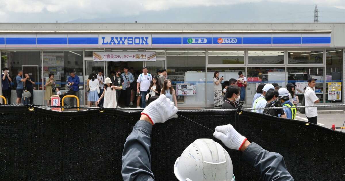 Swarmed with tourists, Japan town blocks off viral view of Mt. Fuji