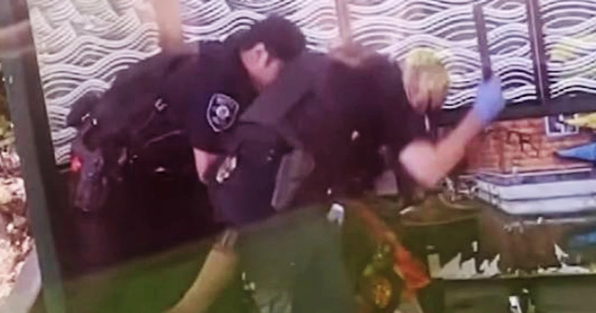 2 police officers under investigation after they were recorded beating a man with batons at a bus stop