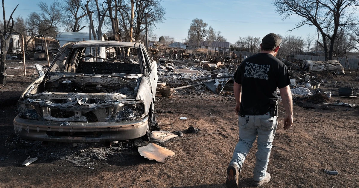 Texas firefighters battle flames stoked by strong winds as warnings are issued across the region 