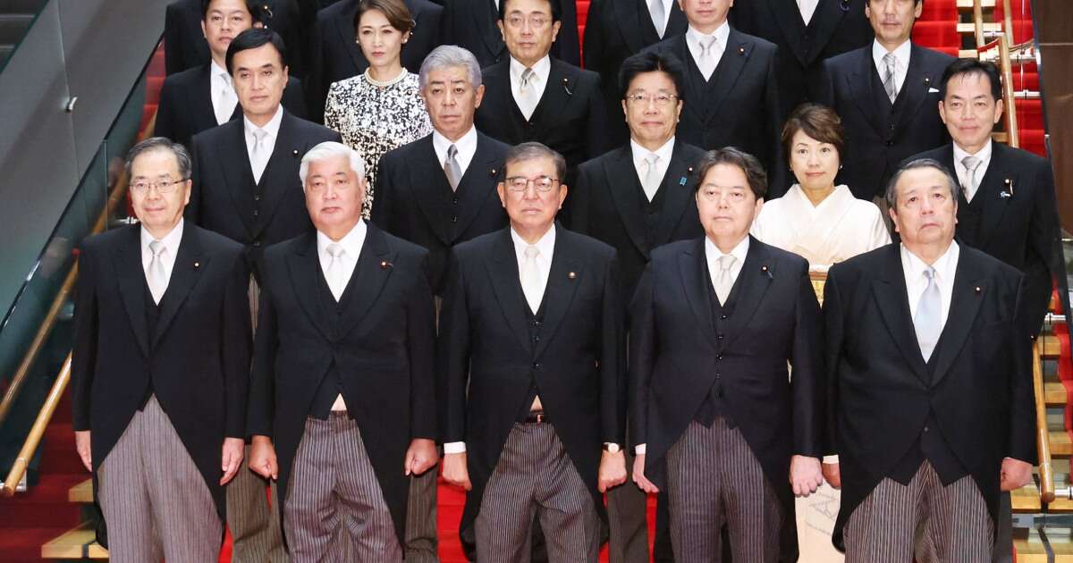 First the royals, now Japan: Government admits doctoring group photo to make suits tidier