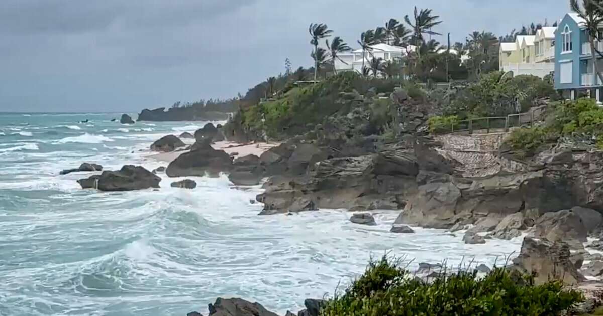 Ernesto weakens to tropical storm status as it moves away from Bermuda and into the open Atlantic