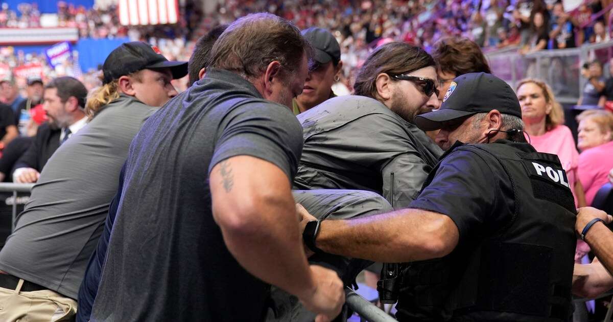 Man arrested at Trump rally in Pennsylvania wanted to hang a protest banner, police say 