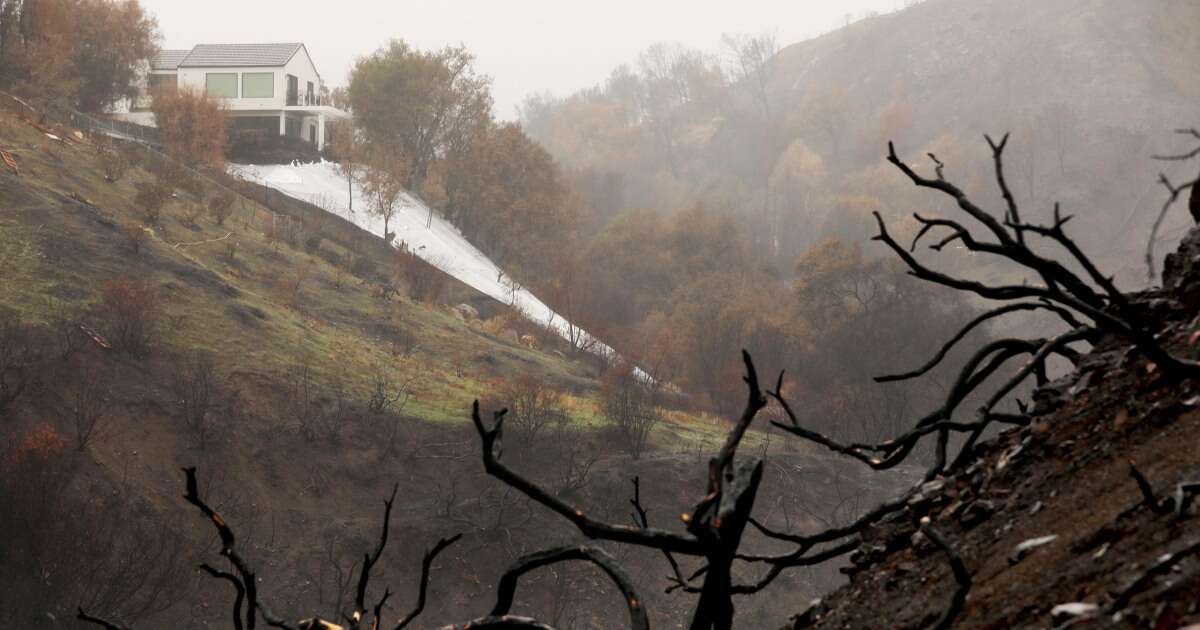 Thousands told to evacuate in LA as powerful storms raises fears over burn scars and debris flow