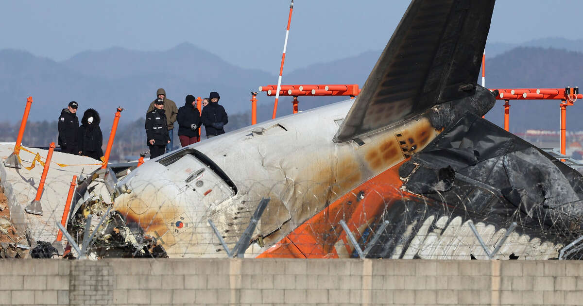 Grieving relatives set up tents in airport as they wait for news of loved ones in South Korea plane crash