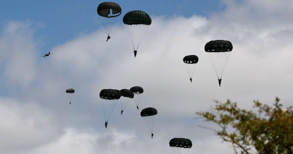 A mass parachute jump over Normandy kicks off commemorations for the 80th anniversary of D-Day