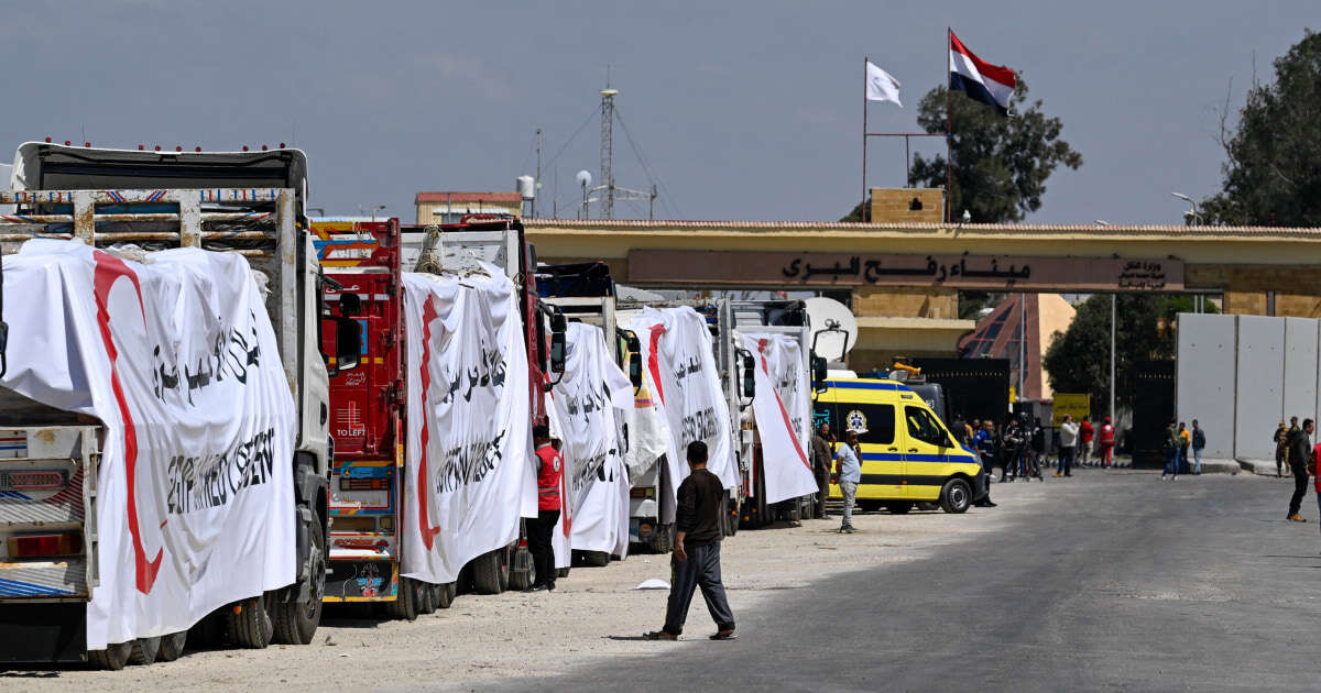 Hundreds of trucks full of aid sit idle near border with Gaza as crisis deepens