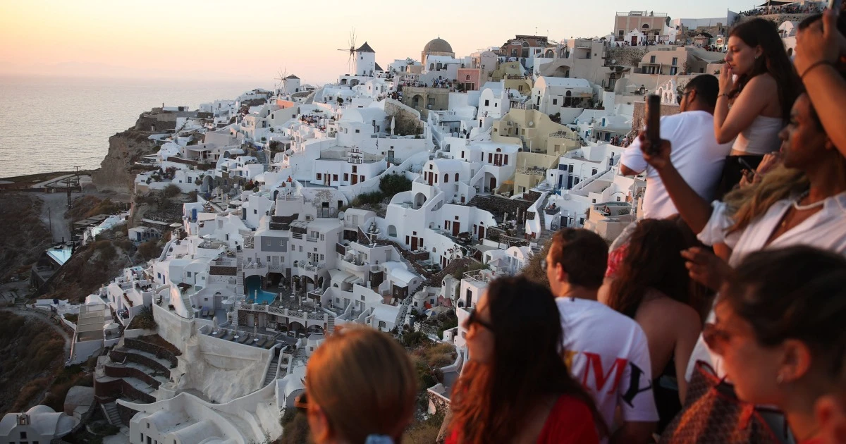 Greece’s Santorini bursts with tourists as locals call for a cap on visitors 