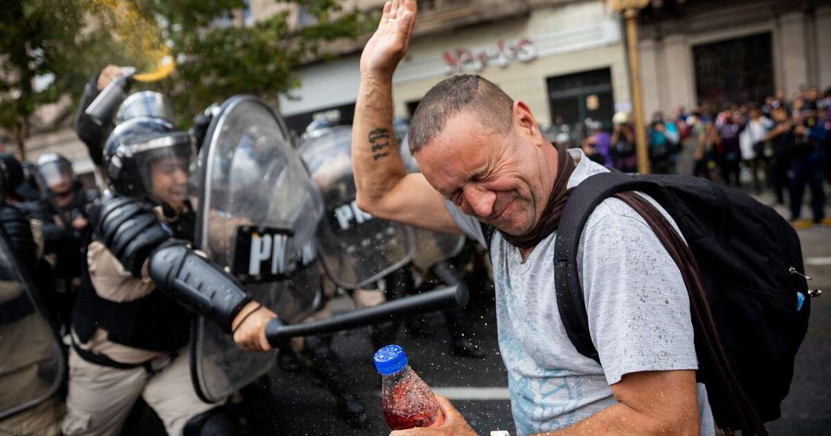 Protesters clash with police after Argentina cuts pension budget