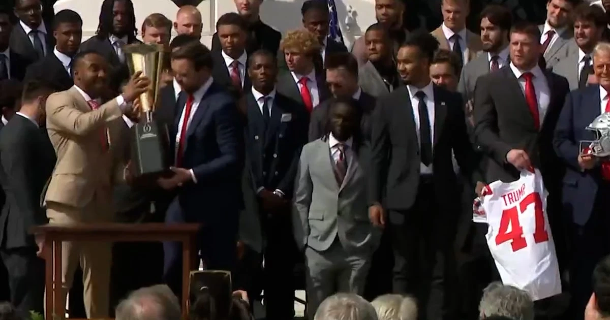 Ohio State football trophy breaks in two as Vance lifts it at White House event