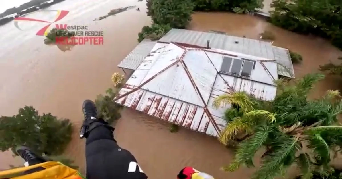 Video shows woman rescued from Australian floodwaters