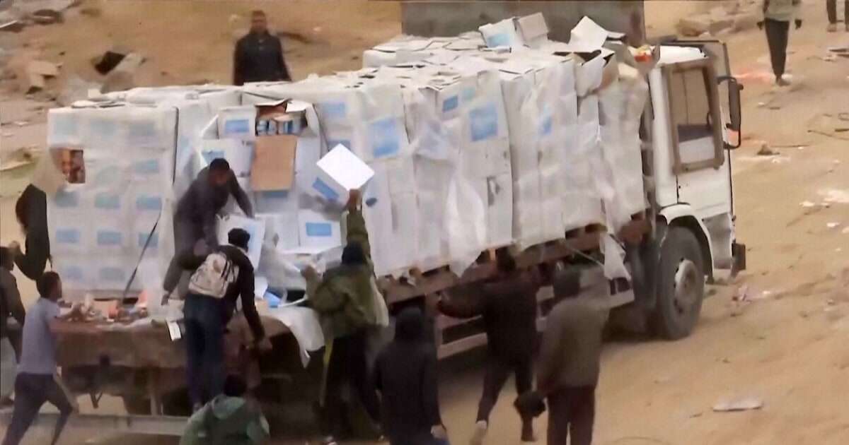 Video shows Palestinians in Gaza dragging aid supplies off the backs of trucks