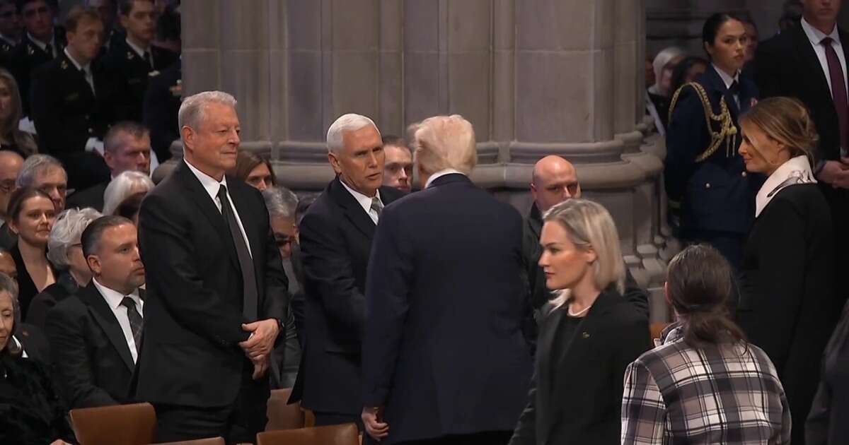 Trump and Pence shake hands at Carter's funeral service