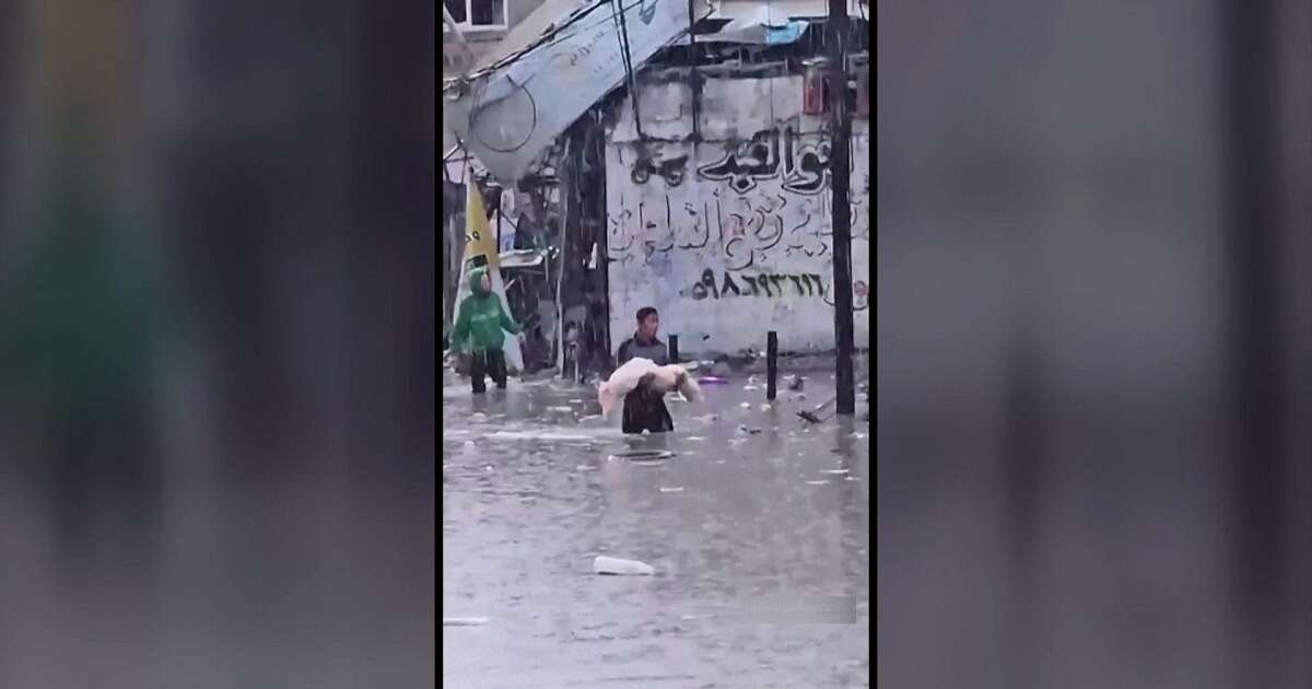 Video shows child’s body carried through Gaza floodwater