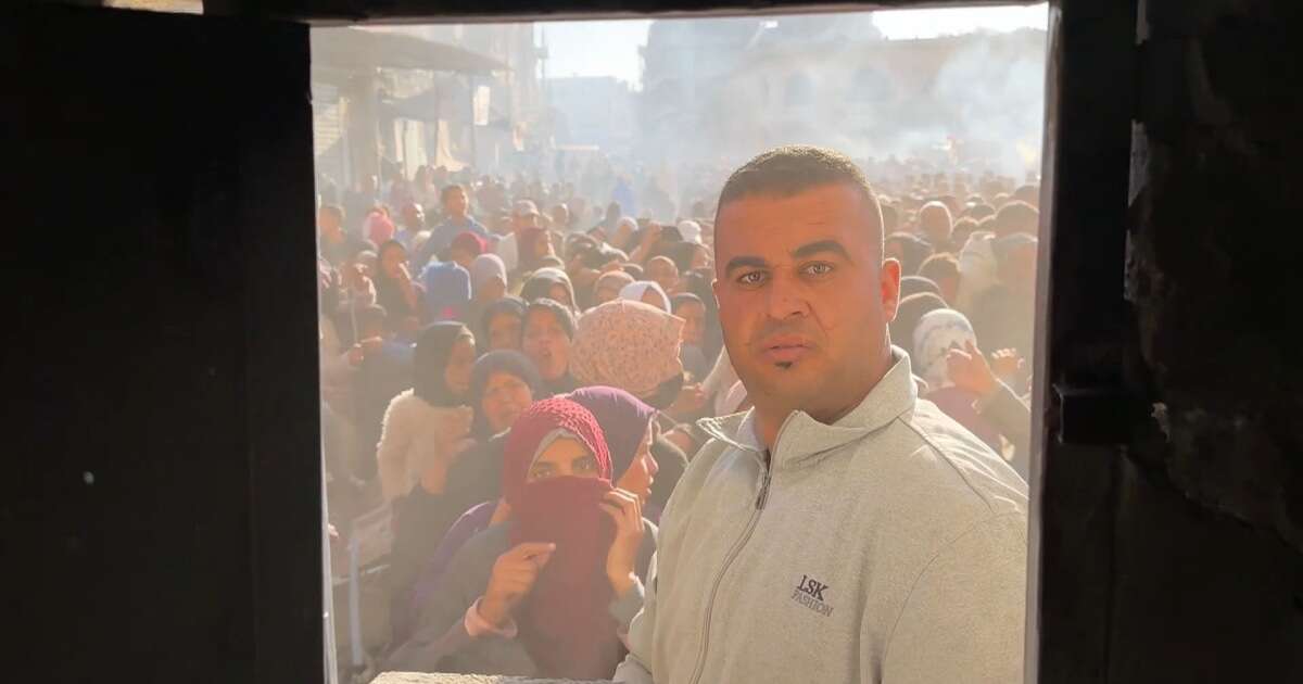 Large crowds wait for bread outside a Gaza bakery as the flour shortage worsens