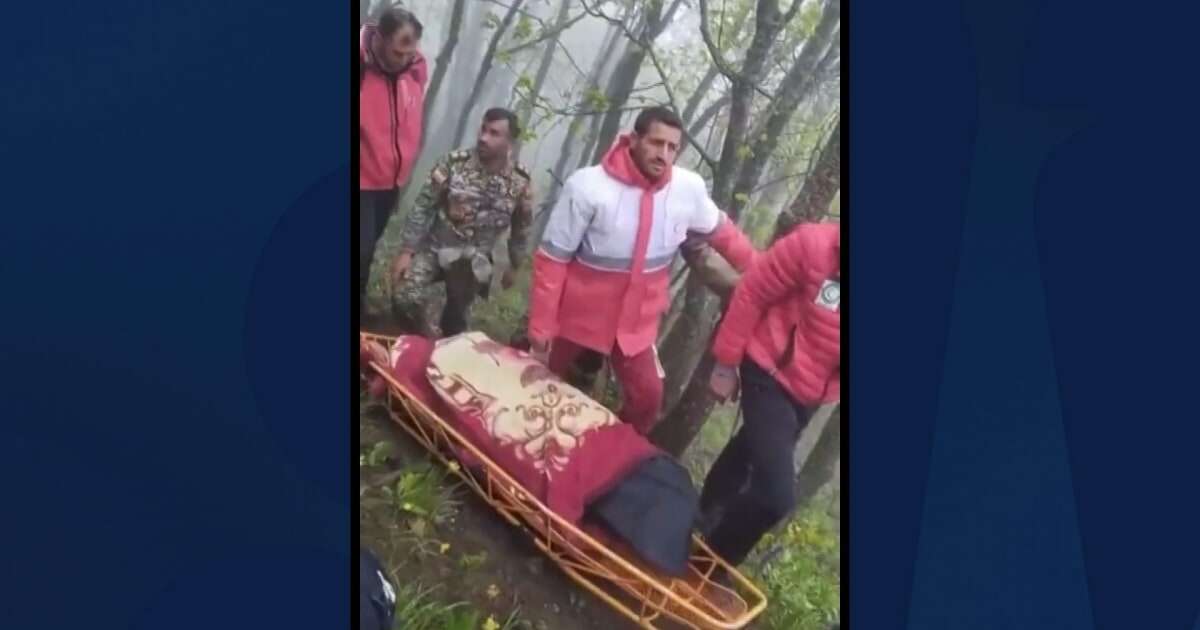 Iranian video shows Red Crescent workers carrying covered body on a stretcher