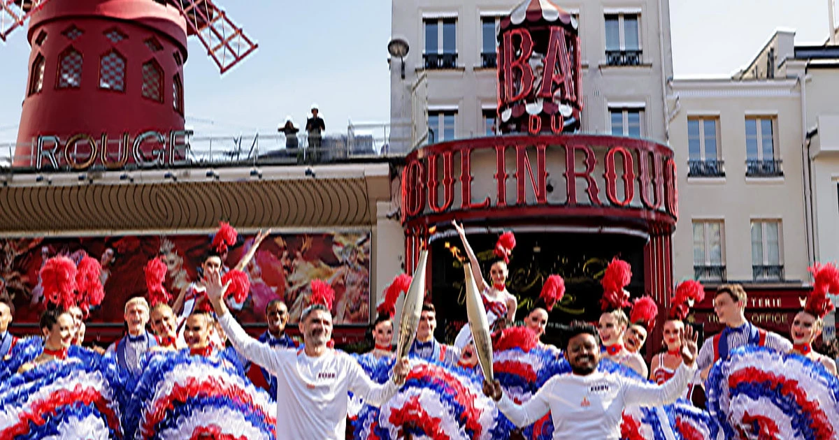 Olympic torch relay helped through Paris by cancan dancers and K-pop star