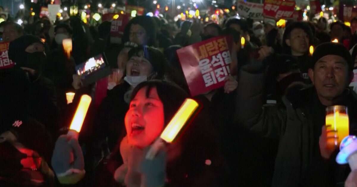 South Korean protesters demand president's impeachment with light sticks and K-pop