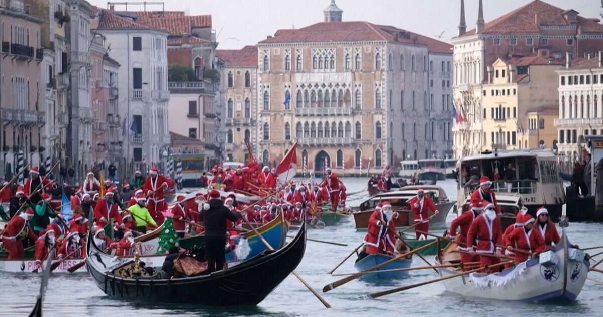 Watch: Santas take over Venice's Grand Canal