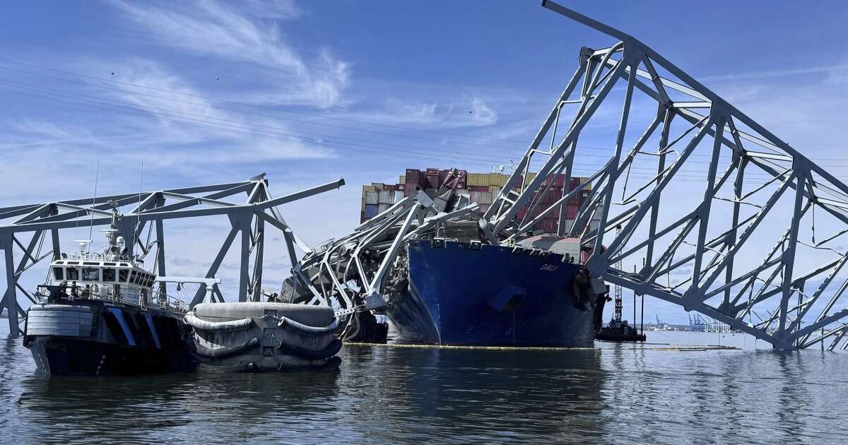 Demolition crews begin cutting into Baltimore bridge wreckage