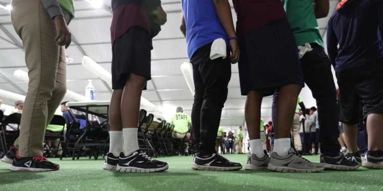 Outreach workers go door to door, looking for separated families