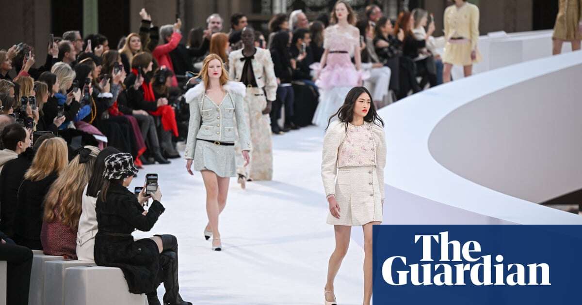 Chanel realigns its logo with bridging catwalk at show focused on timeless skirt suit