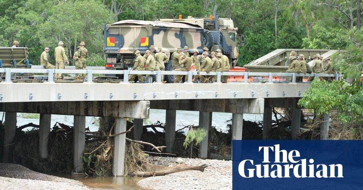 Towns cut off by Queensland floods warned against panic-buying as premier vows ‘resilient’ rebuild