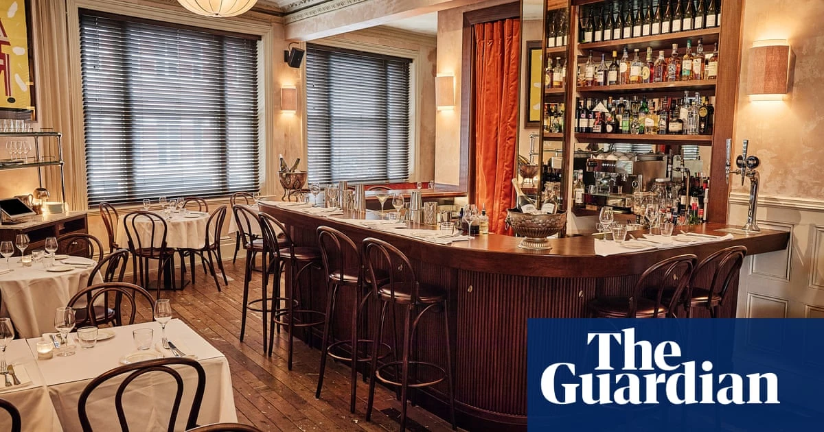 One Club Row, London E1: ‘Battered stuff, things in buns, strong drinks: a thrilling, retro ride’ – restaurant review | Grace Dent on restaurants