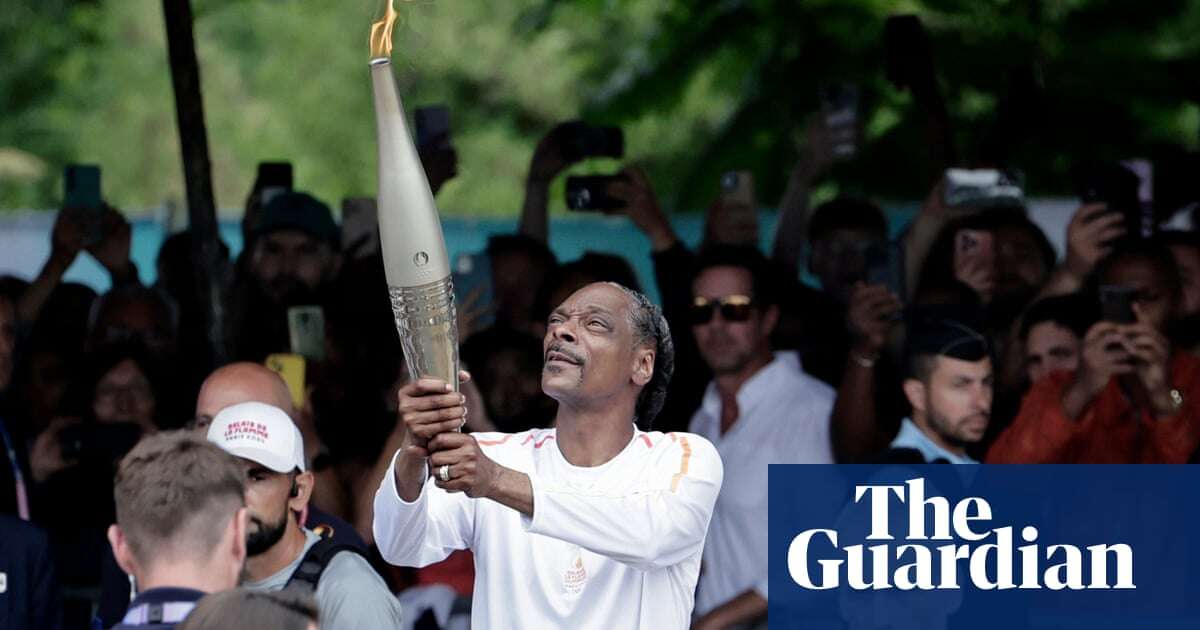 ‘It’s peanut butter and jelly’: Snoop Dogg embraces Olympic torch baton role