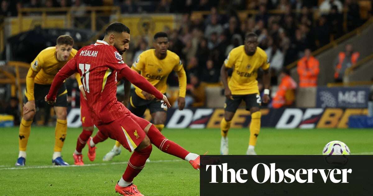 Mohamed Salah’s penalty sees off battling Wolves to send Liverpool top