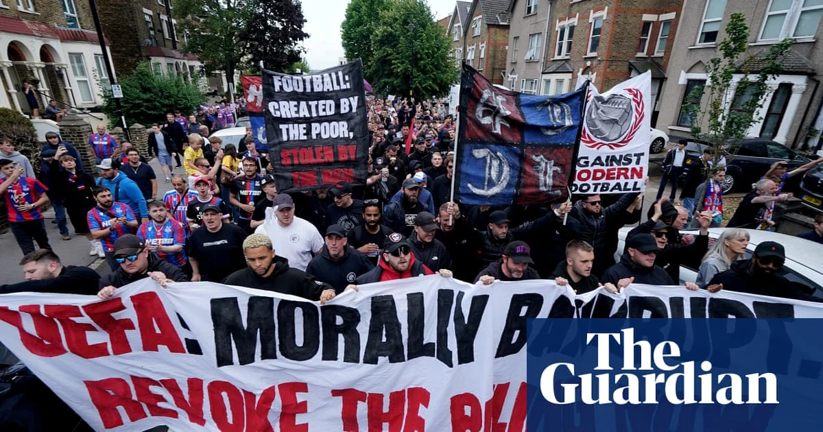 ‘It’s not fair’: Crystal Palace fans march in protest at demotion from Europa League