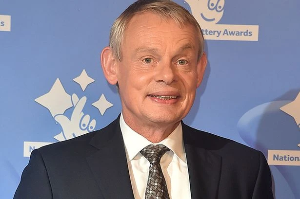 TV star Martin Clunes went swimming with dolphins and one pooed in his face