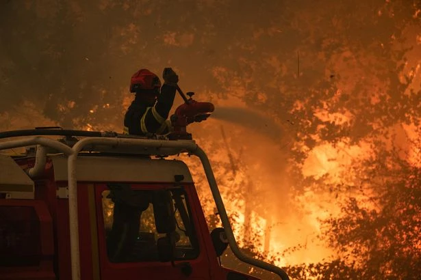 Entire city could be evacuated as deadly wildfires sweep across nation