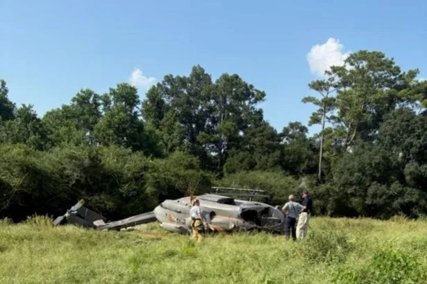 Three on board military chopper which crashed into private field after 'aviation mishap'
