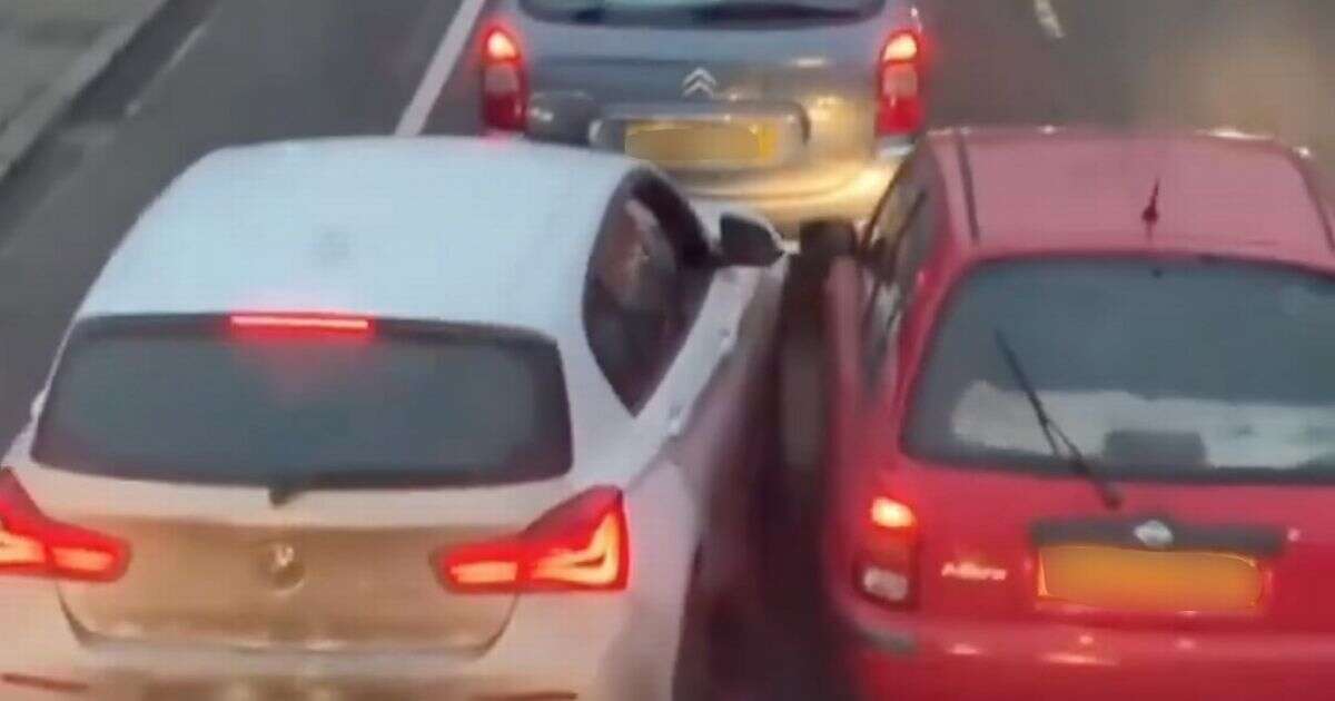 Moment stubborn BMW driver refuses to let car into lane in bizarre road rage row