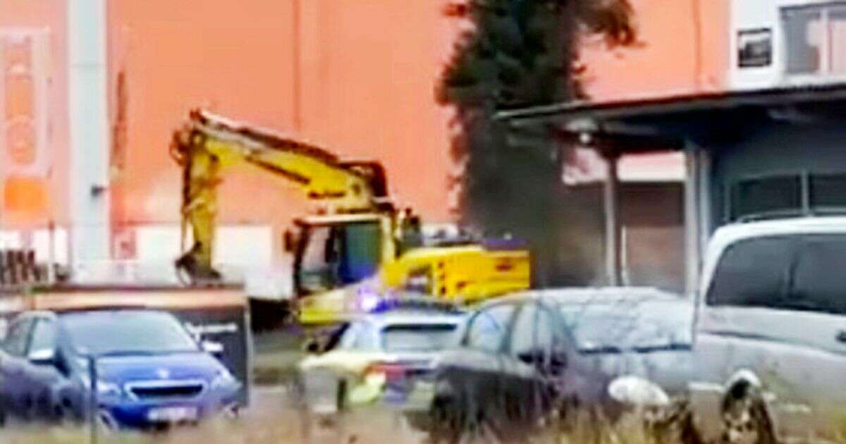 Stolen digger goes on rampage down street as armed police swarm vehicle