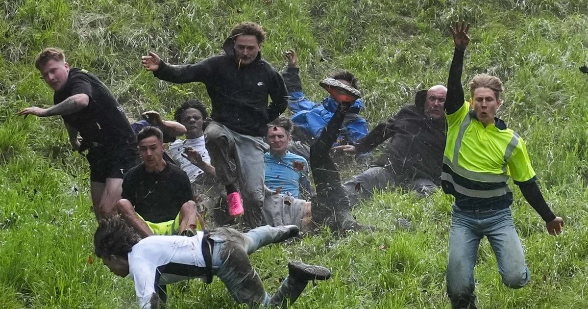LiveCooper's Hill cheese rolling festival LIVE: Bizarre chase to see dare devils hurtle down hill