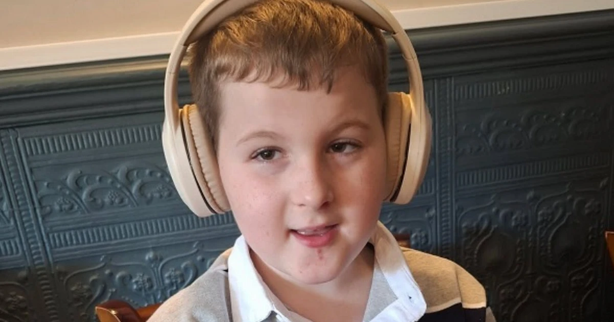 'Lovely' boy, 8, found dead at home pictured as woman, 40, charged with 'murder'