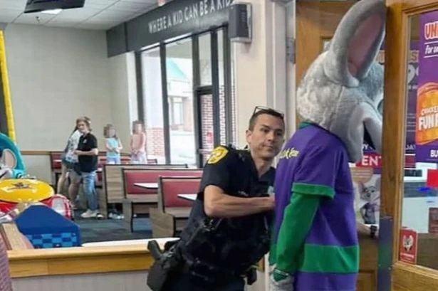 Popular mascot Chuck E Cheese gets arrested and cuffed in front of crying kids