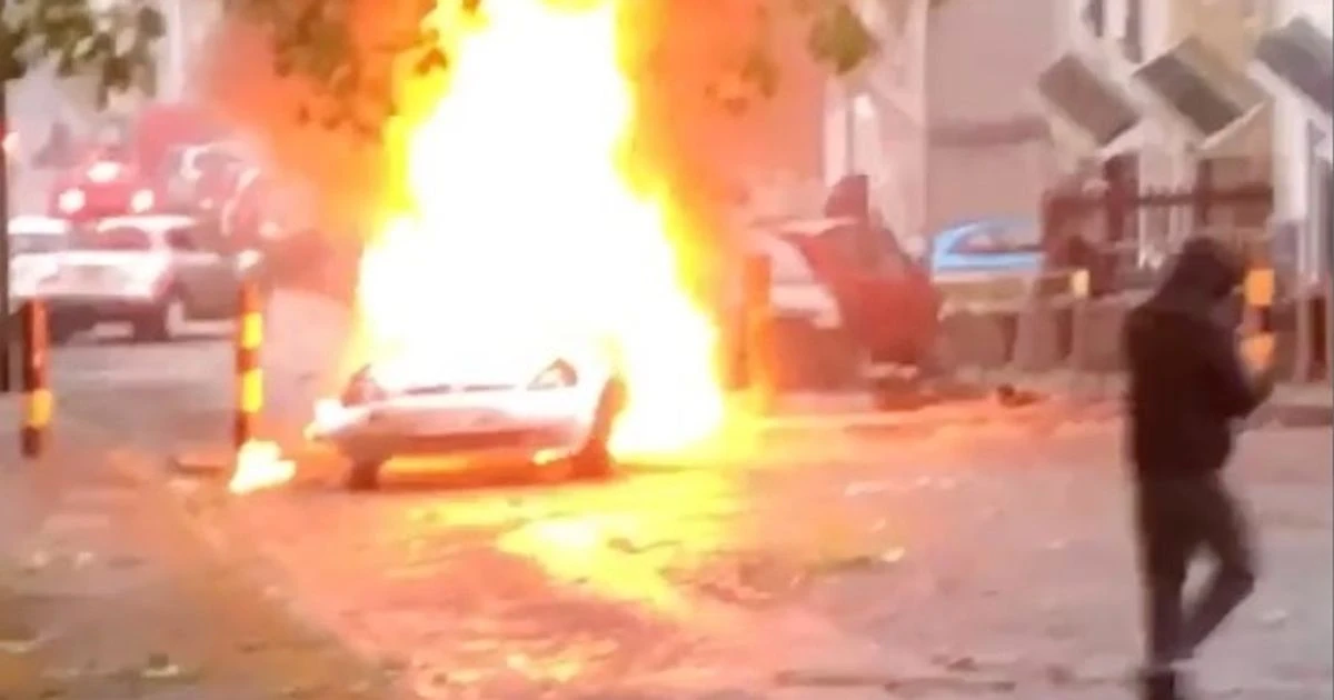 Terrified boy asks 'are we going to die mummy?' as 200 yobs set cars on fire at vigil